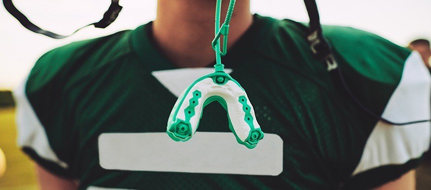 green and white mouthguard