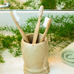Bamboo toothbrushes in a cup
